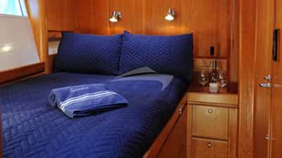 Starboard forward cabin has a queen bed with priva
