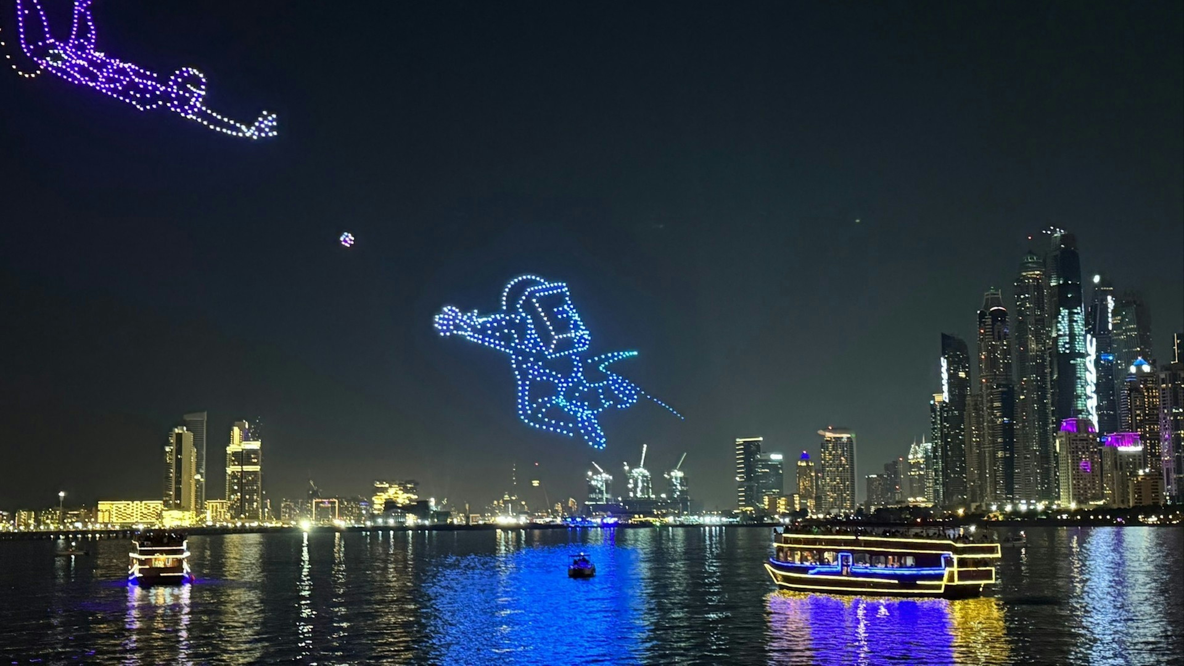 Drone show on Dubai beach with Palm Jumeirah