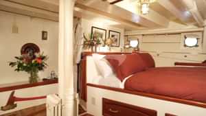 Stateroom 3: Queen Bed shown (+ 2 Single Beds)