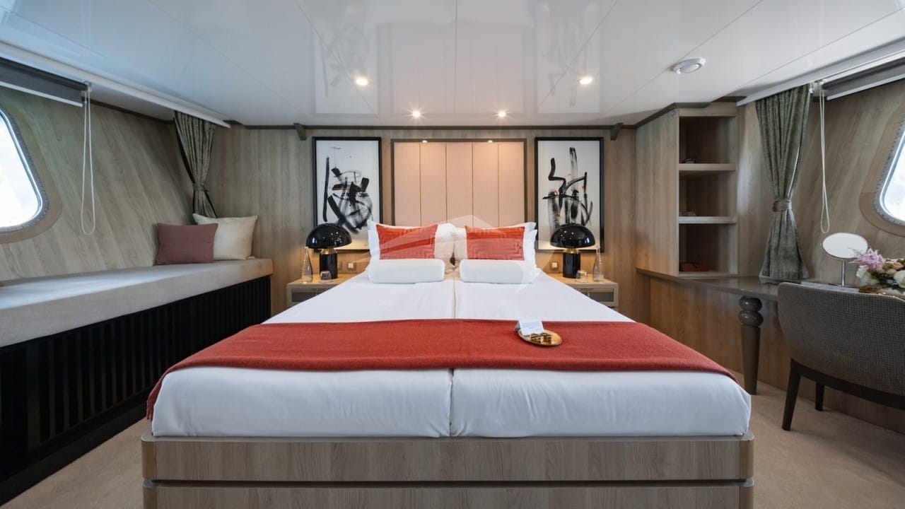 VIP full-beam master stateroom with a queen bed