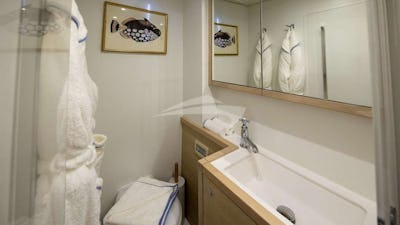 En suite bathrooms with standing shower, plush robes, and artisanal bath & body products created exclusively for NOMADA.