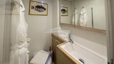 En suite bathrooms with standing shower, plush robes, and artisanal bath & body products created exclusively for NOMADA.