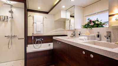 Master bath with twin sinks, full tub & large stall shower