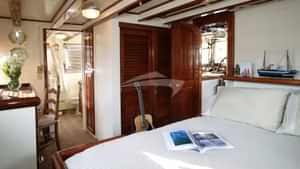 VIP Stateroom with Queen Bed on Upper Deck.
