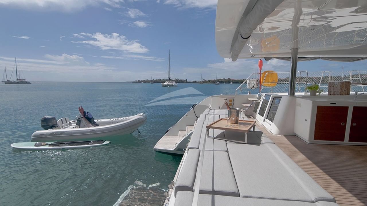 The tender and paddle board from the stern