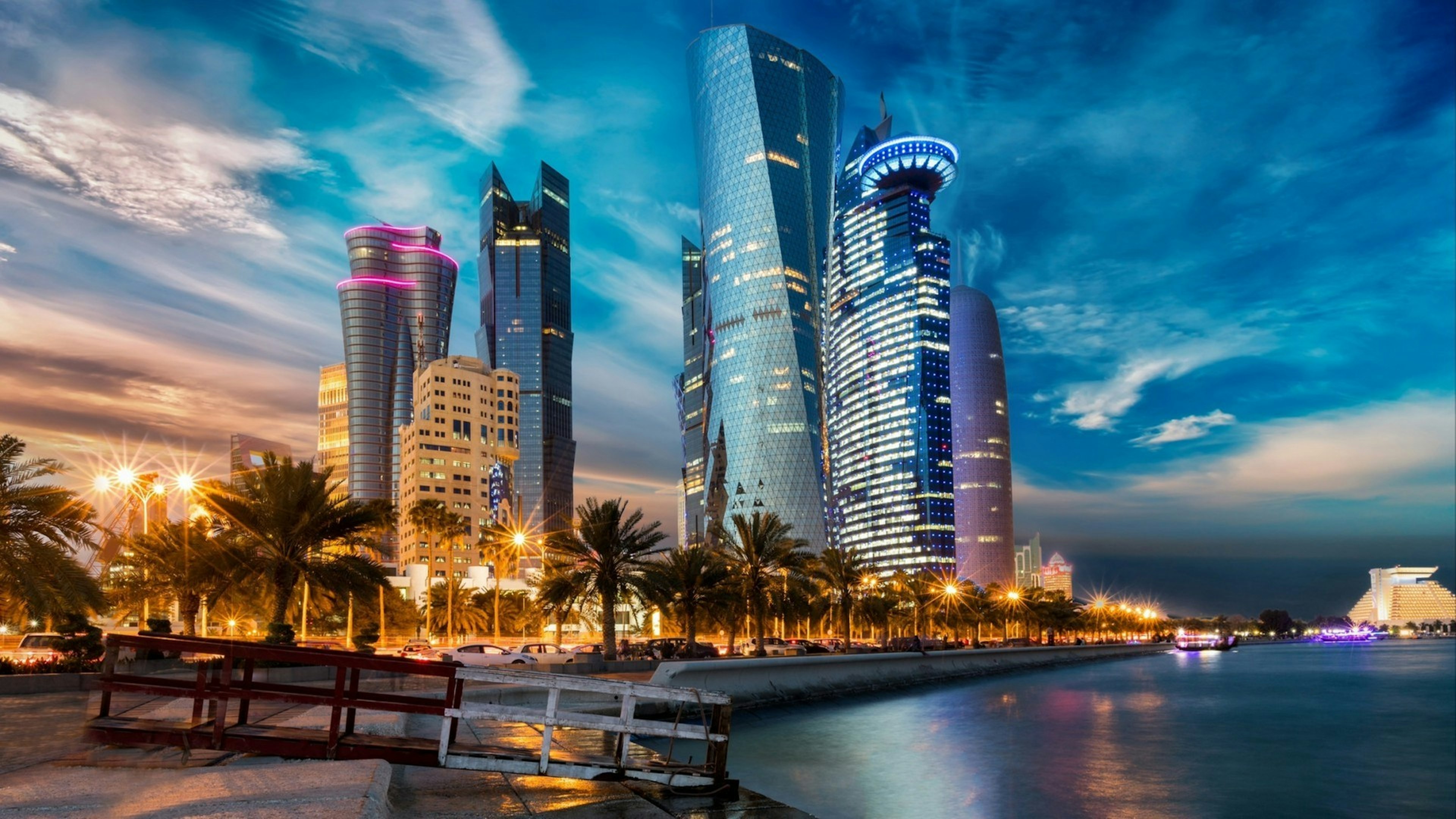 The skyline of Doha city center after sunset, Qatar
