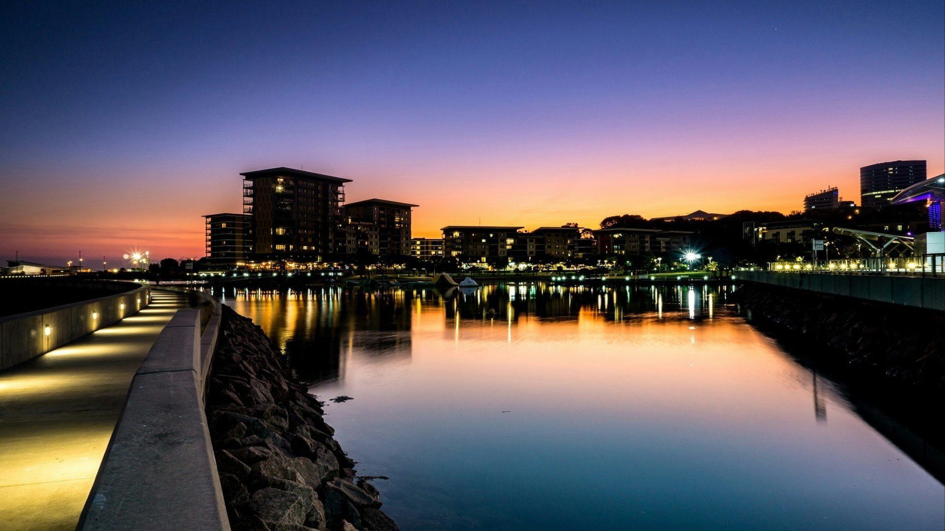 Sunset at the Waterfront in Darwin Northern Territory Australia with illuminated path and night lighting.