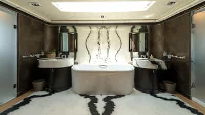Master en suite - bathtub, his and hers showers and sinks