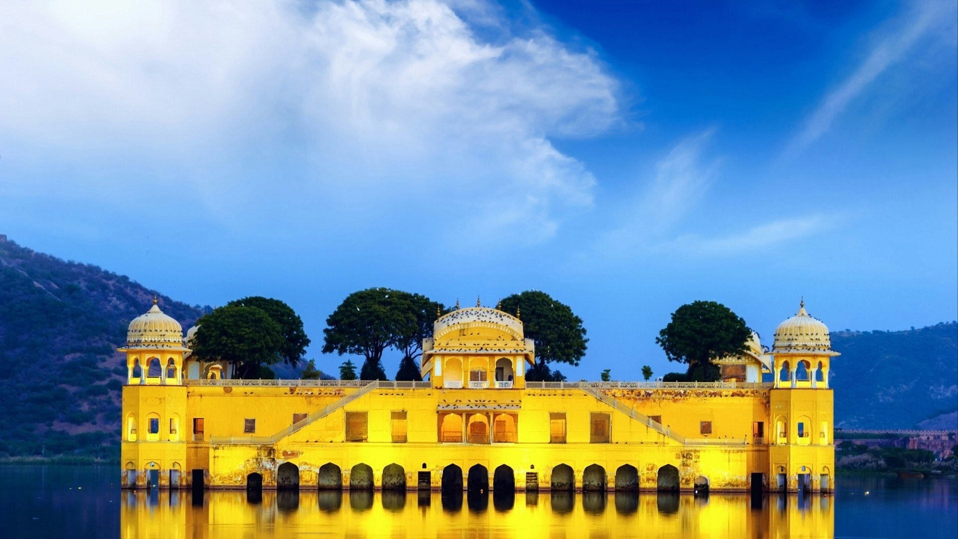 Indian water palace on Jal Mahal lake at night time in Jaipur, India