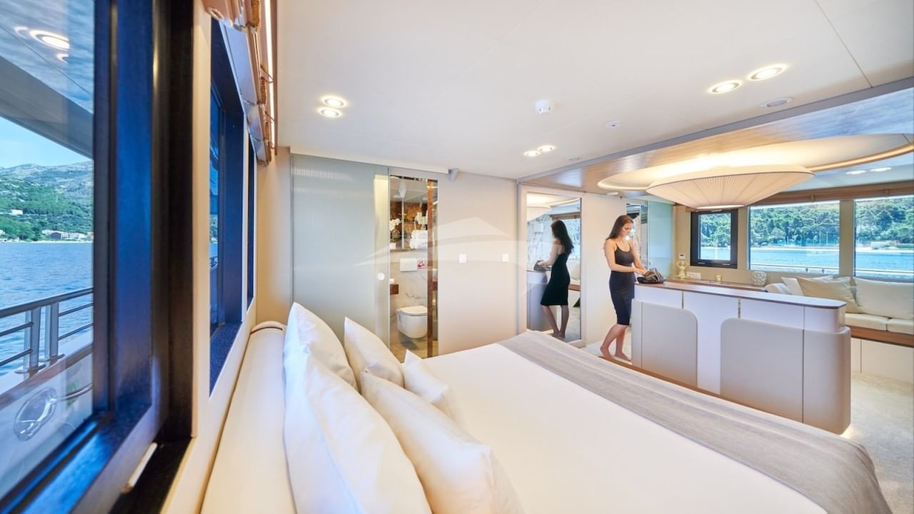 Main deck full beam master stateroom (2) with large Smart TV on central stand