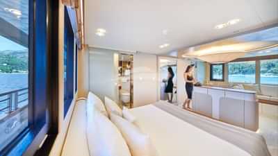 Main deck full beam master stateroom (2) with large Smart TV on central stand