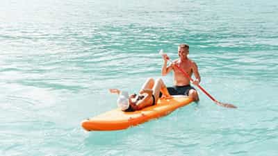 Paddleboarding available on board.