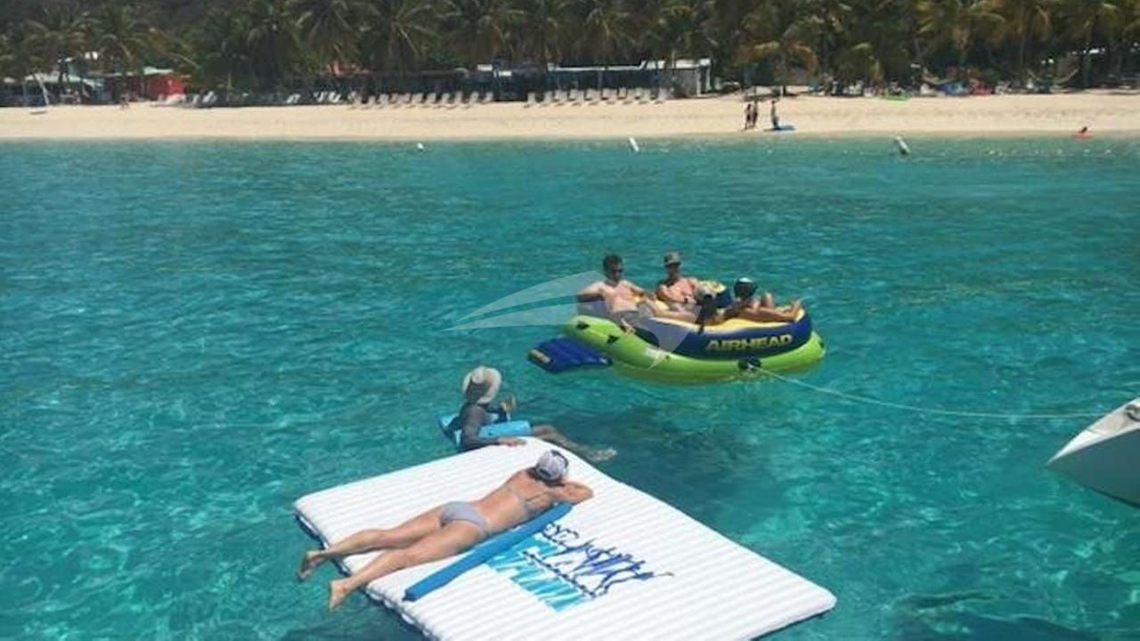 Guests relaxing on floating mats