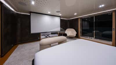 Master stateroom with 4K Ultra HD projection screen with Apple TV