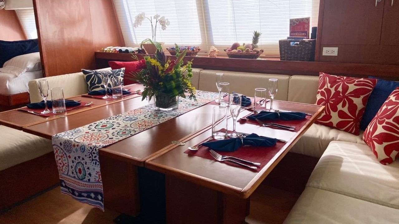 The saloon features a cozy dining space with wrap-around seating.