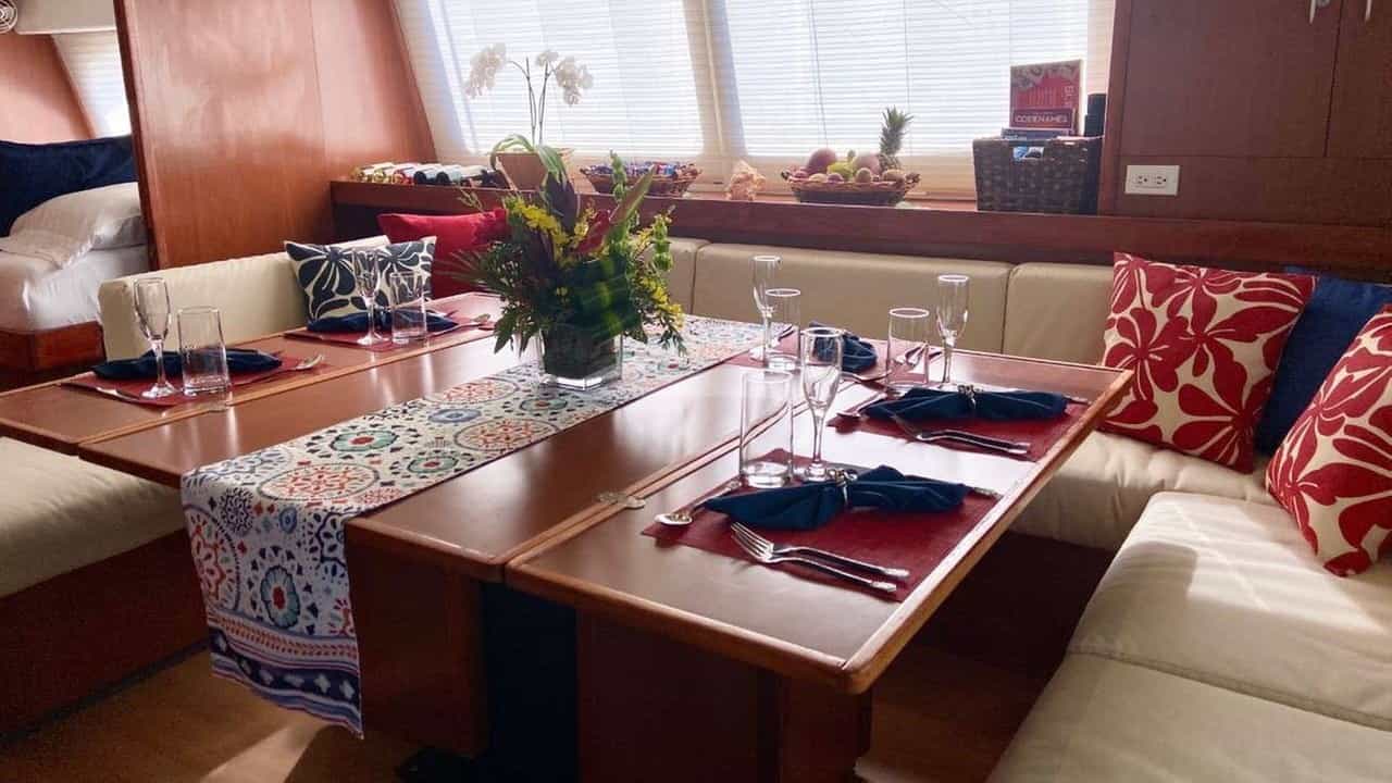 The saloon features a cozy dining space with wrap-around seating.