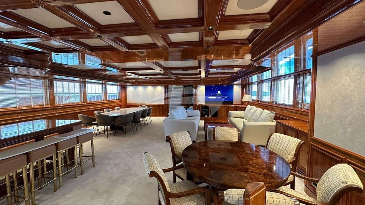 Entry into the Main Salon sees a bar area and dining on the Port side and sofas and a games table on the starboard