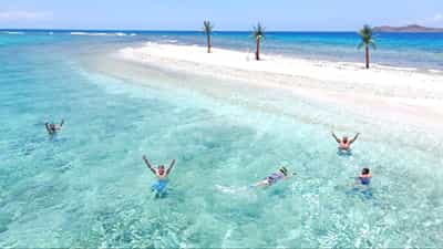 Guests at the Necker Island sand spit
