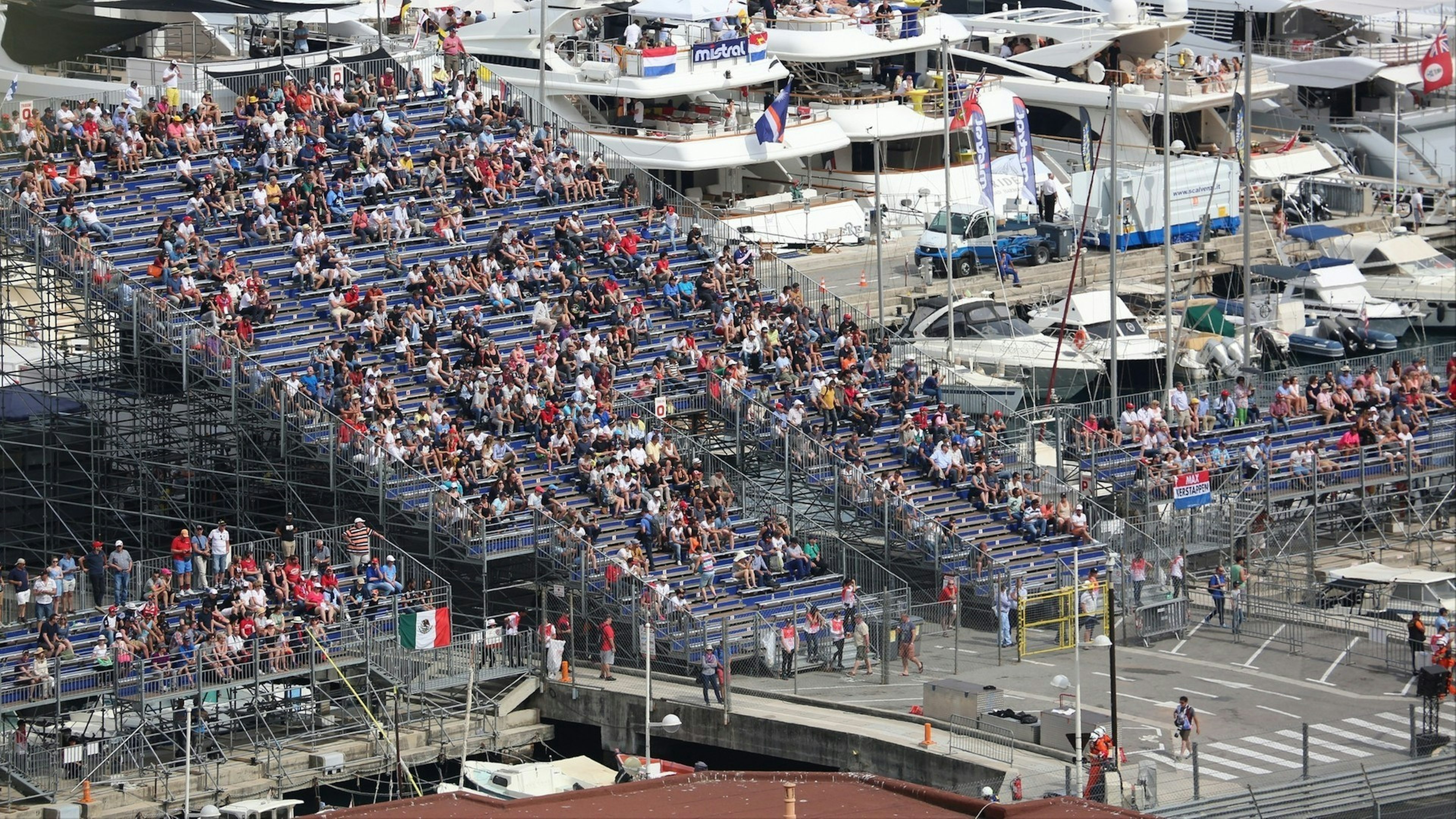 Many Spectators in the Tribunes and People on Yachts For the Monaco Formula 1 Grand Prix
