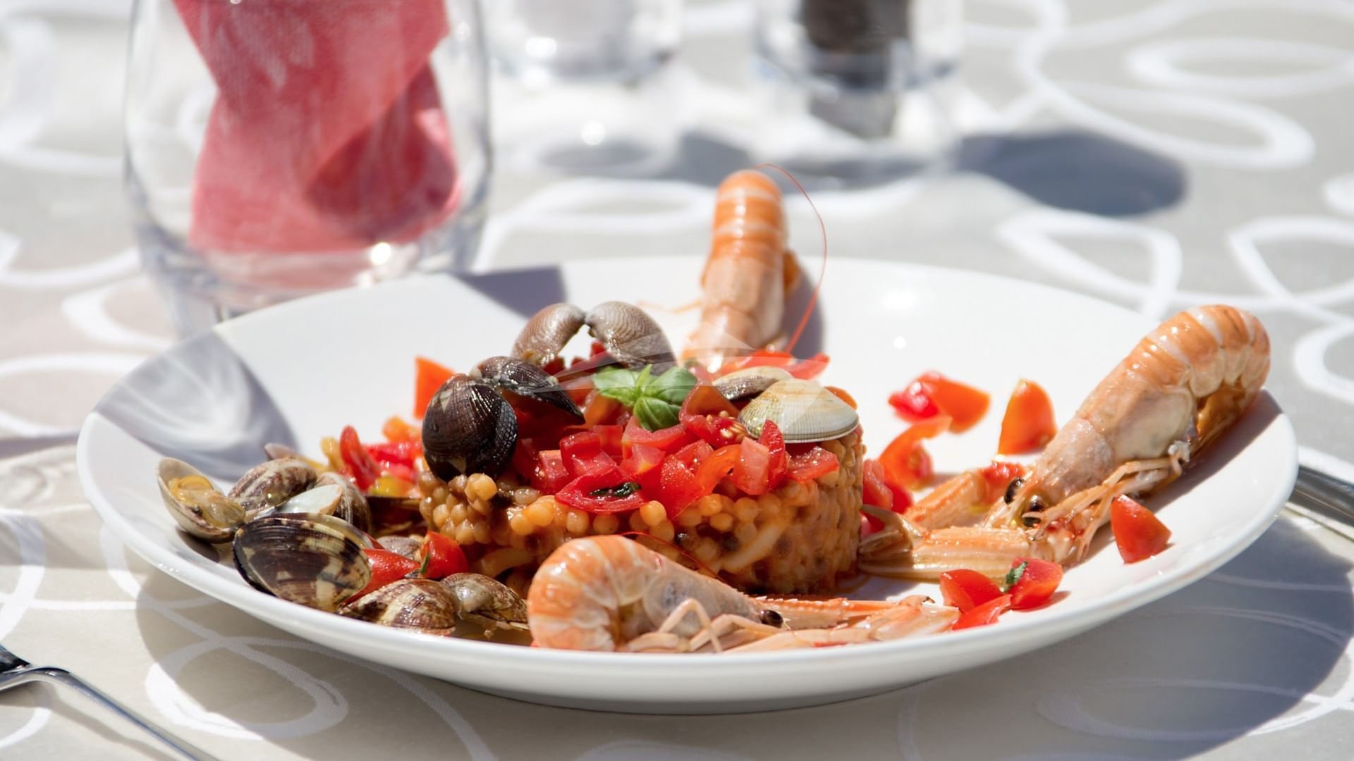 "fregole" with tomatoes, seafood and king prawns