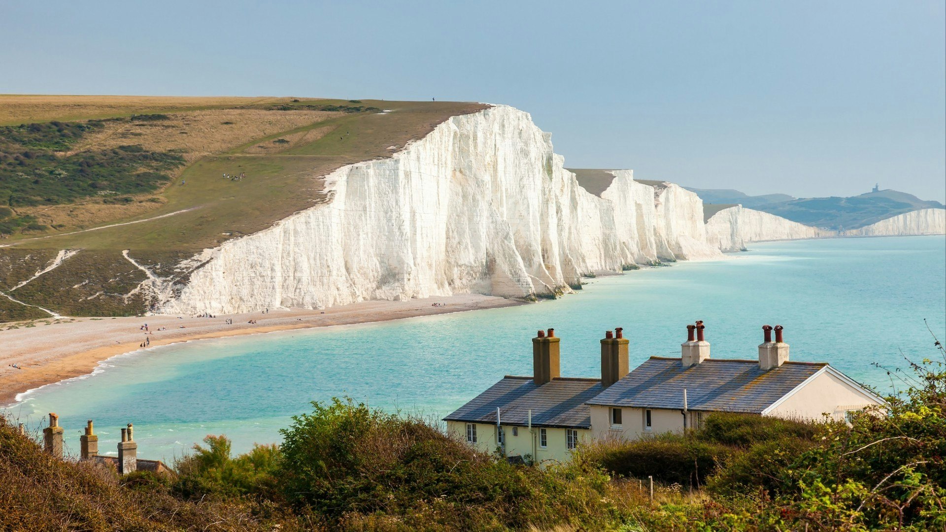The Seven Sisters Chalk cliffs and the coastguard cottages, from Seaford Head South Downs East Sussex England UK