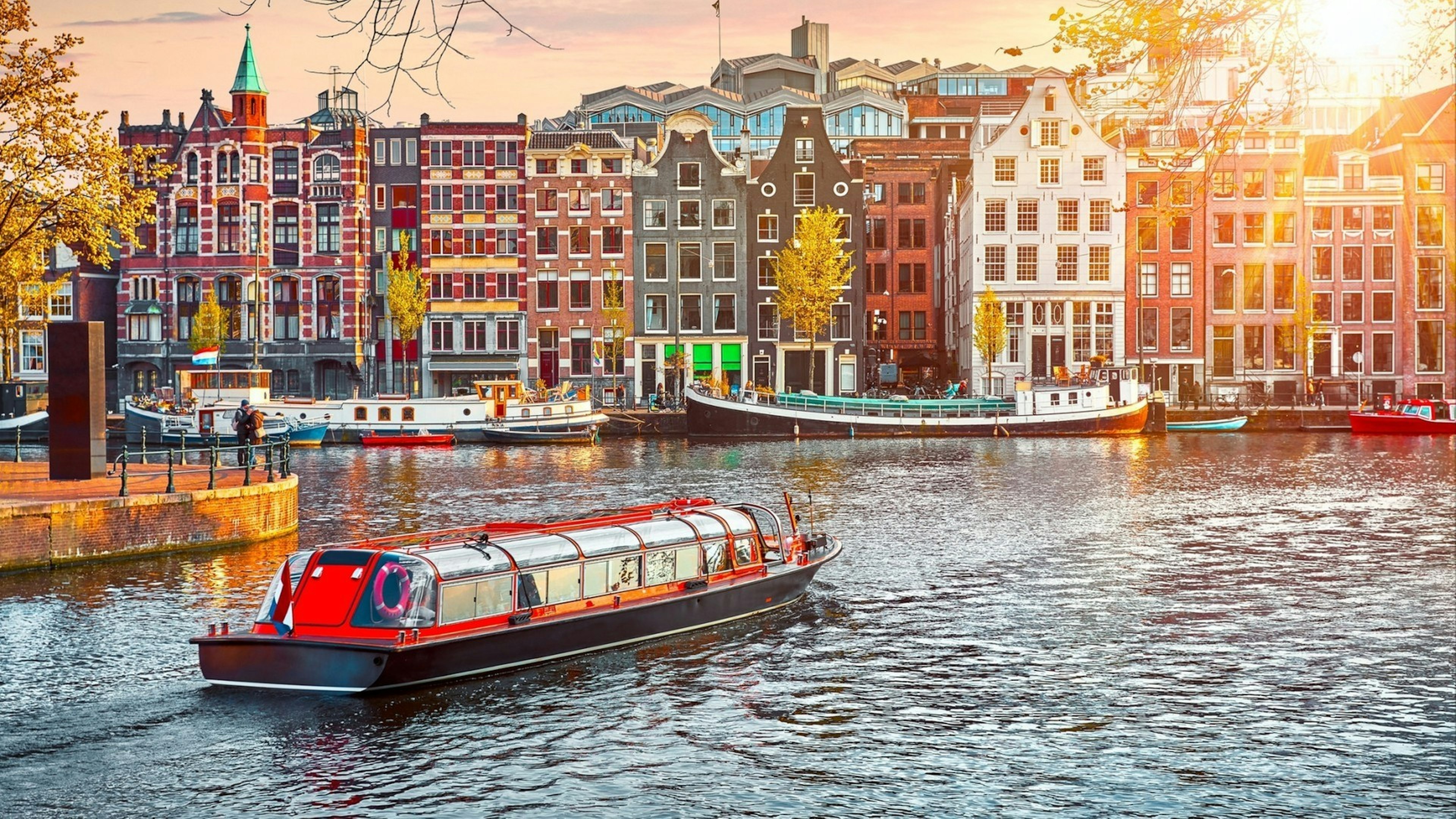 Channel in Amsterdam Netherlands houses river Amstel landmark old European city