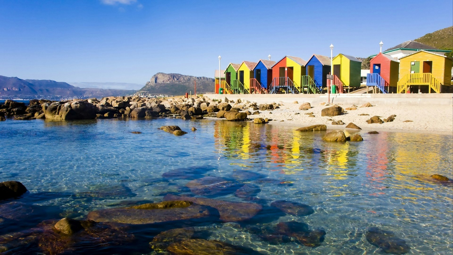 St James Beach with colourful bathing boxes, Cape Town, South Africa