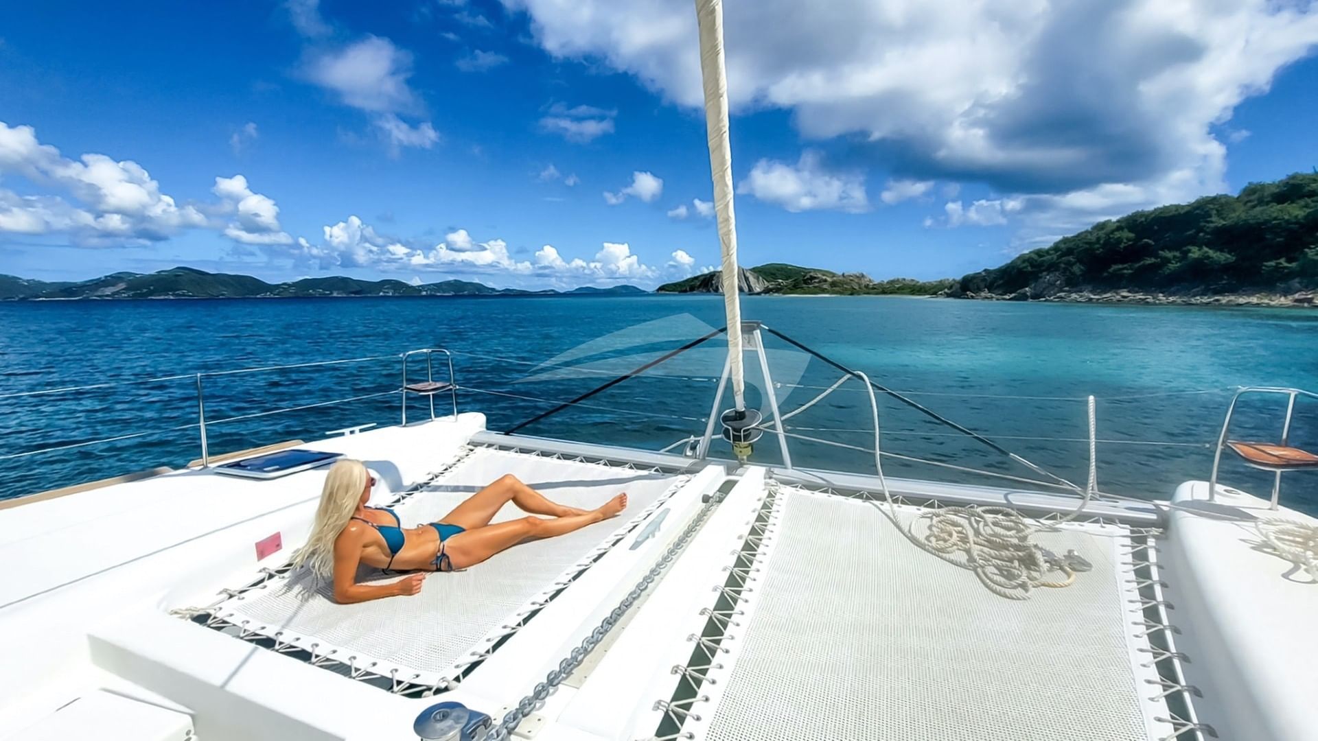 Sunning on the foredeck trampolines