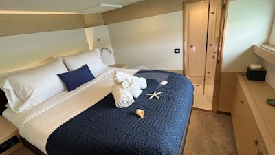 Starboard forward VIP Queen Cabin with view of e-suite bathroom