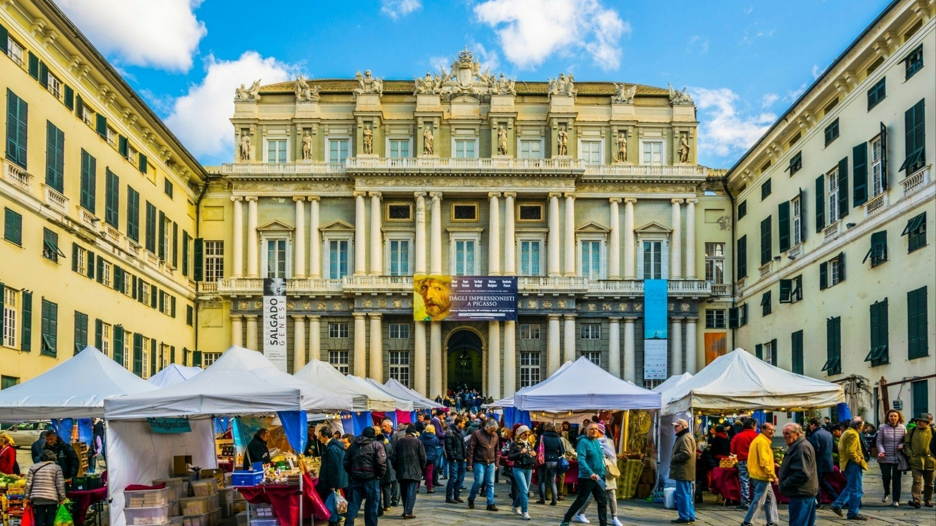 People are enjoying sunny day on the square raffaele de ferrari in front of the palazzo ducale Genoa, Italy