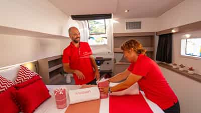 Charter Yacht VIENNA - crew performing housekeeping service in cabin