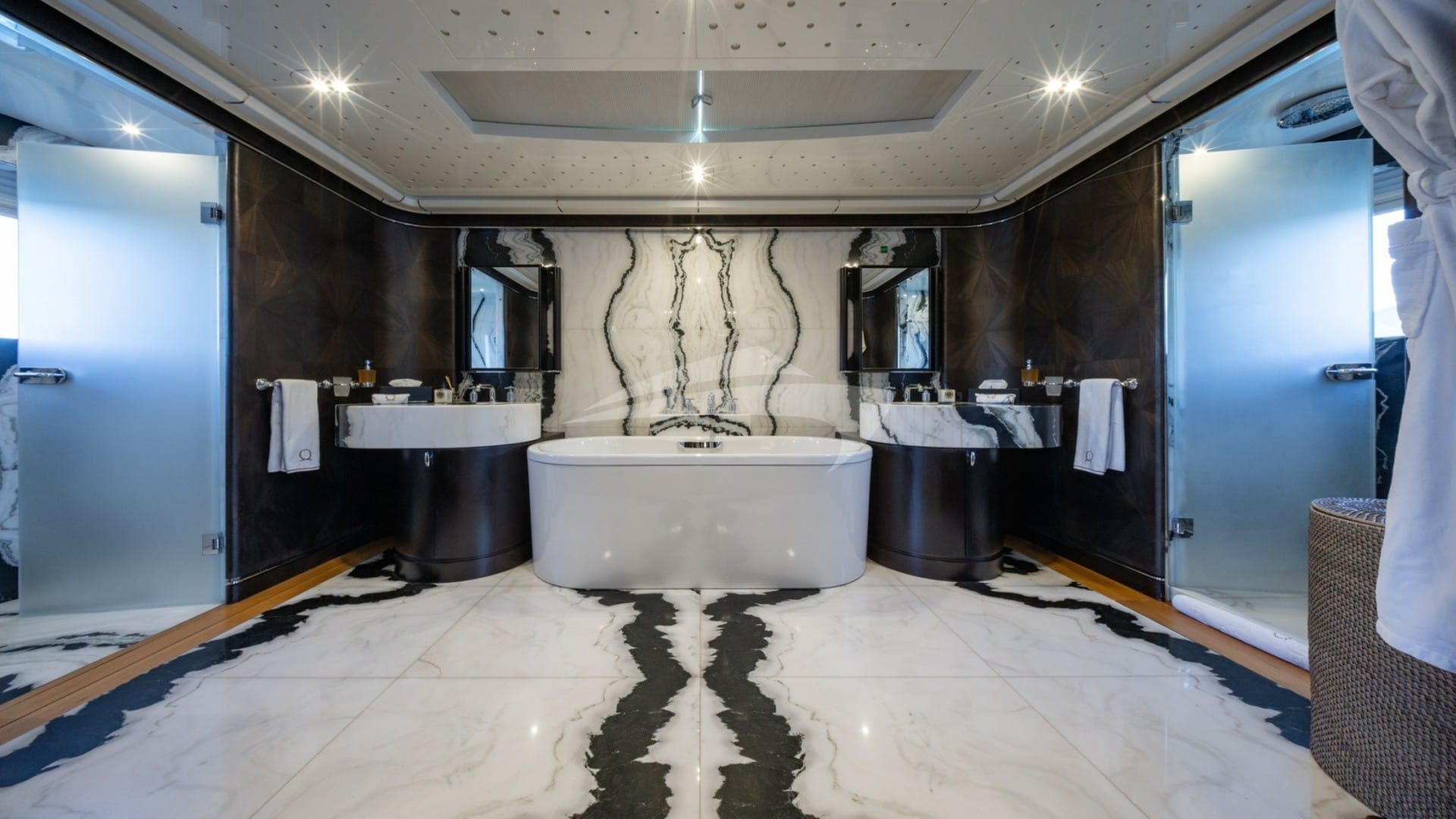 Master en suite with large bath, and his and her showers and sinks