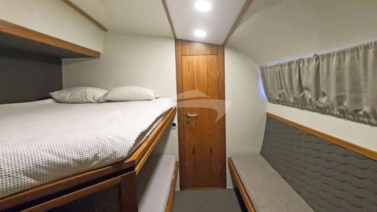 Upper double & lower single berths in all cabins
