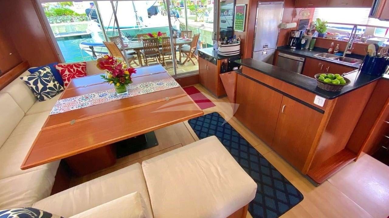 The open aft dining deck is just outside the galley/salon space.