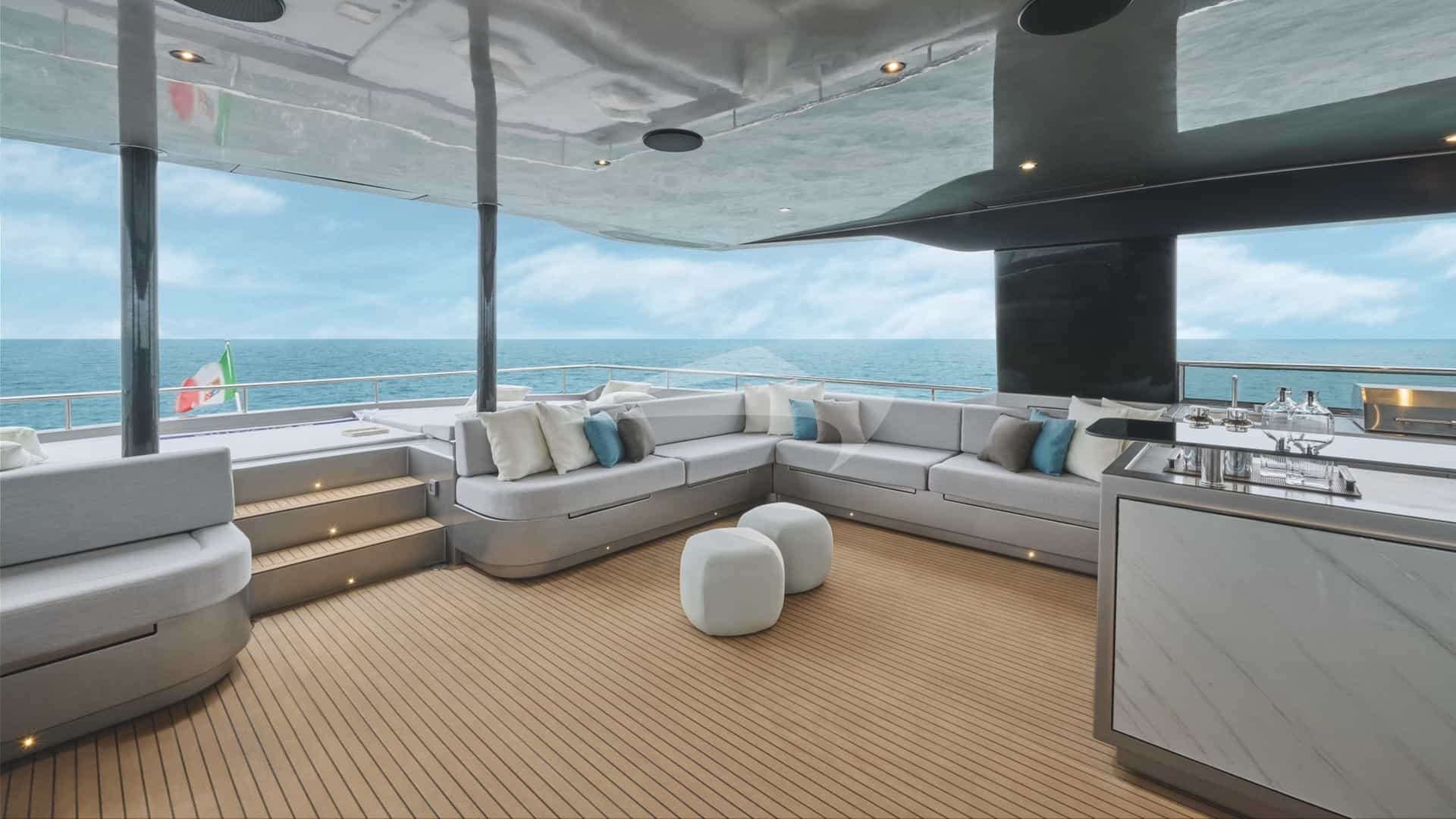 Lounging area on the flybridge, with sunloungers aft