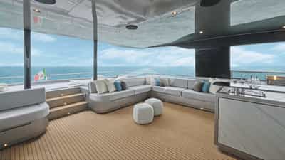 Lounging area on the flybridge, with sunloungers aft