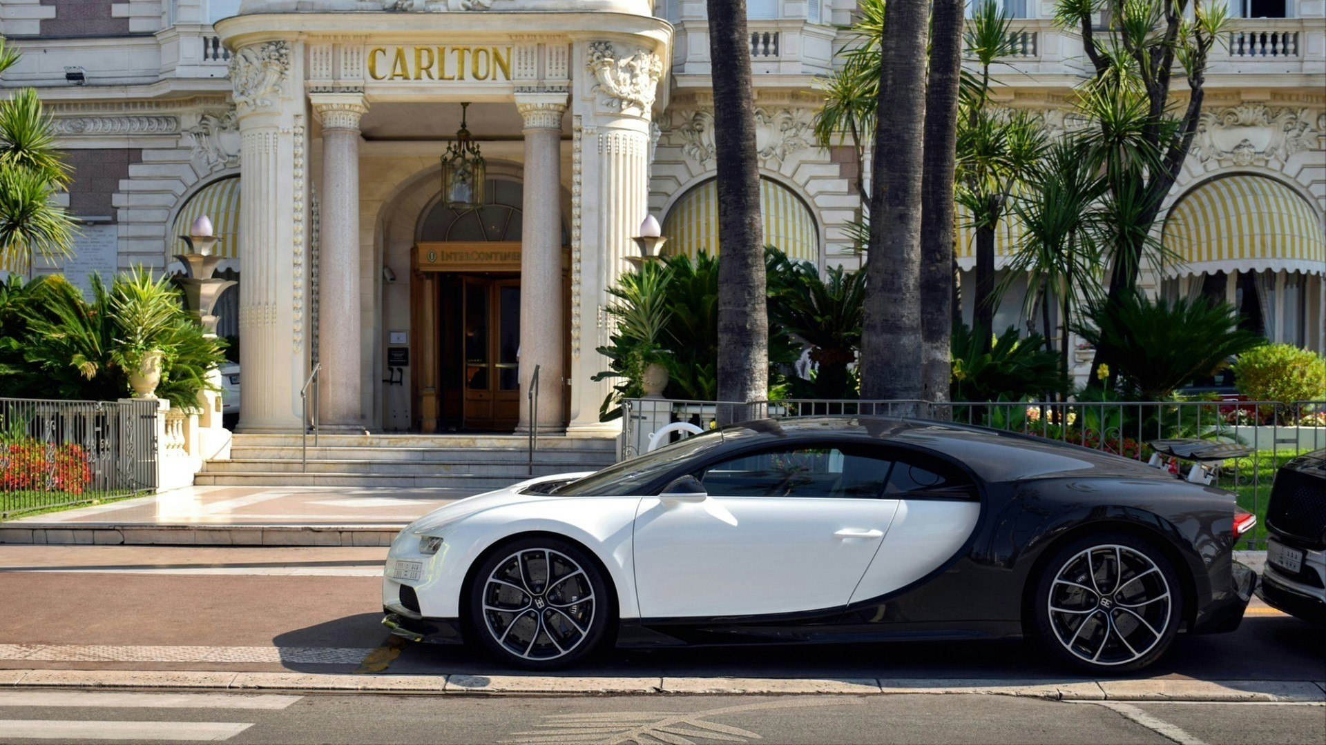 Bugatti Chiron hypercar parked in central Cannes, by a luxury hotel