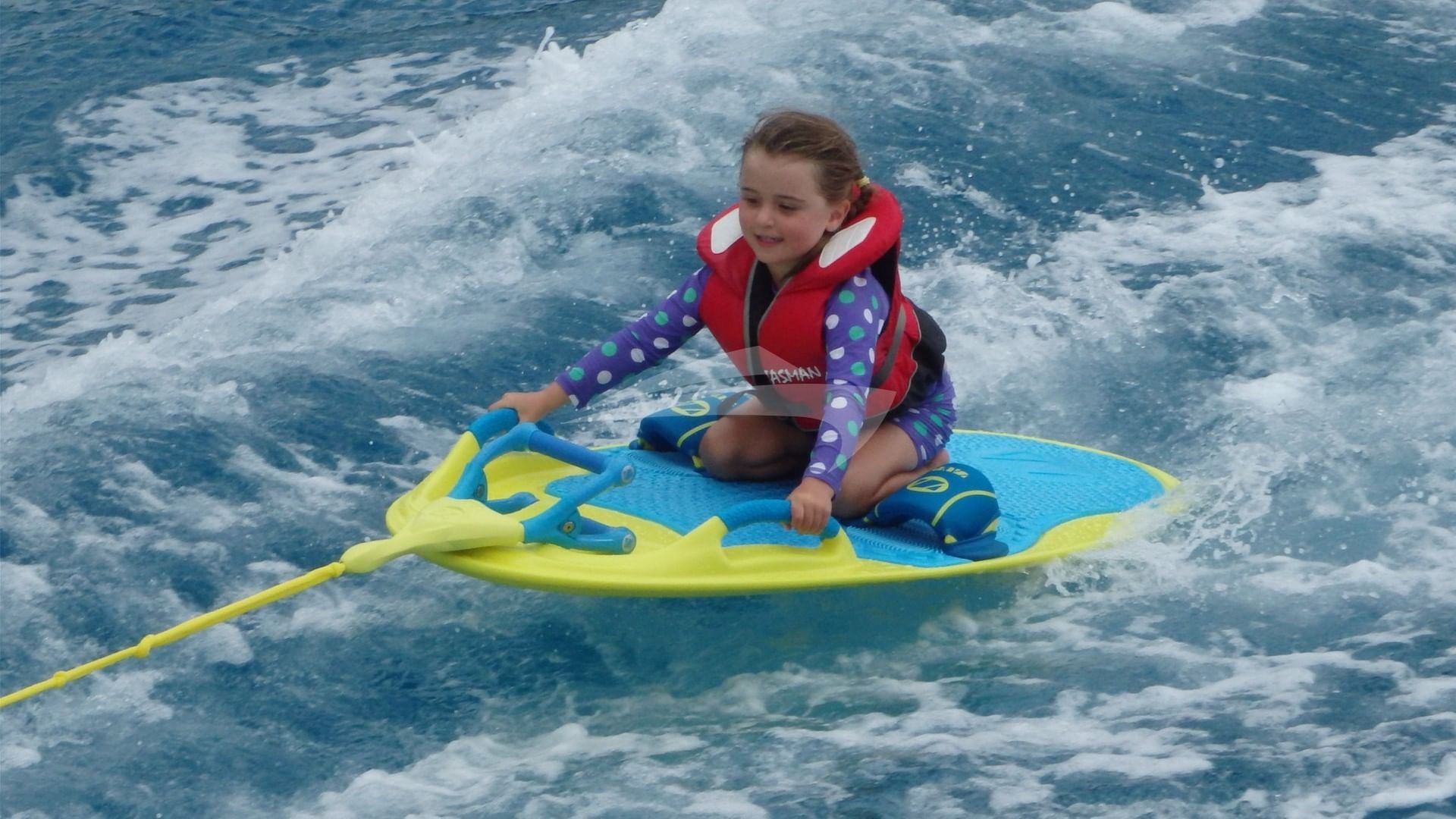 Younger guests having fun on the wakeboard