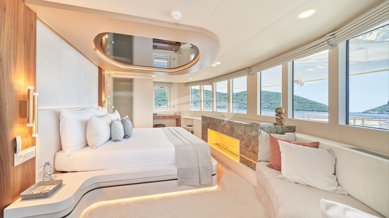 Master stateroom with king size bed, Smart TV and panoramic views from upper deck