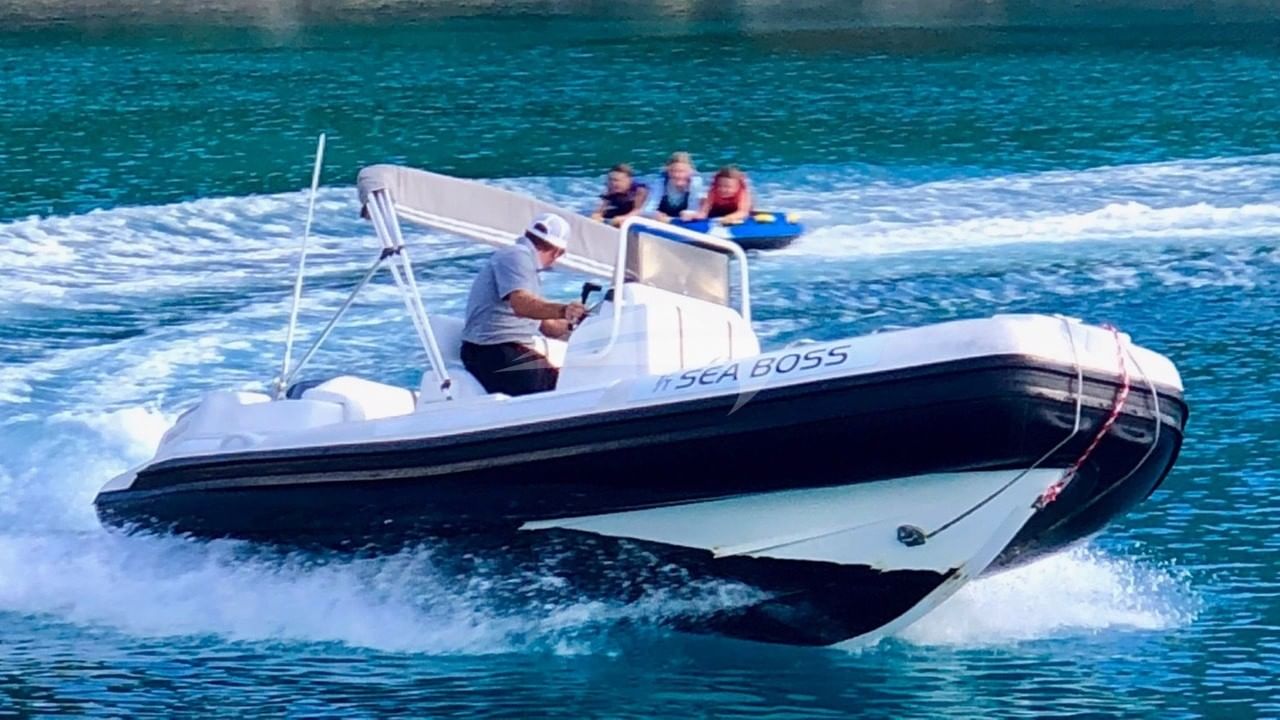 Tubing behind the 19' Nautica tender
