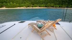 Lounge on the flybridge in the teak steamer chairs