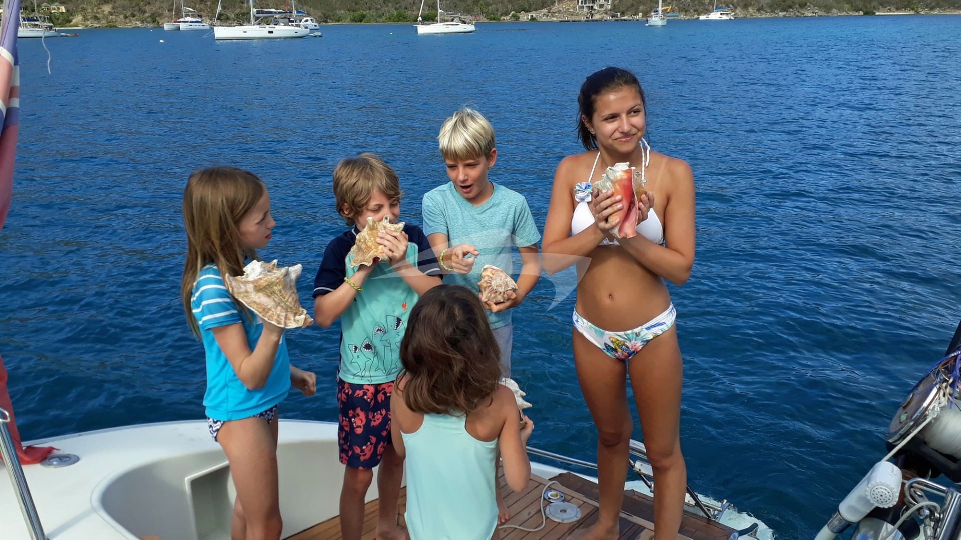 Blowing conches for the kids to take home