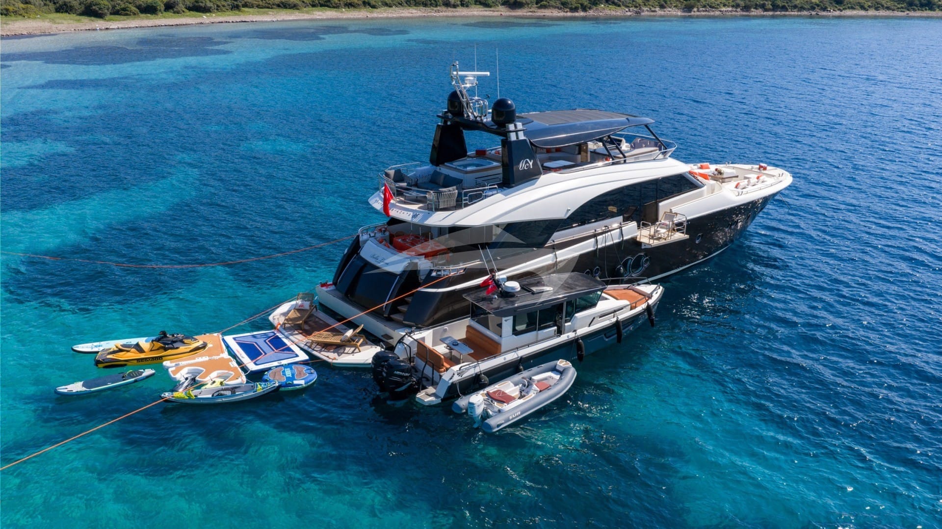 At anchor with tenders and toys