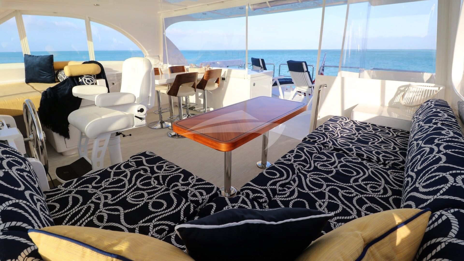Flybridge helm, dining and lounging area